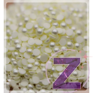 Kép 2/2 - félgyöngy körömdísz halványsárga színben