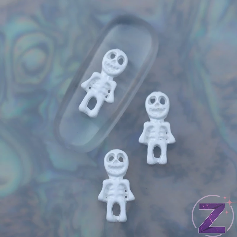 zodiac körömékszer fehér csontváz